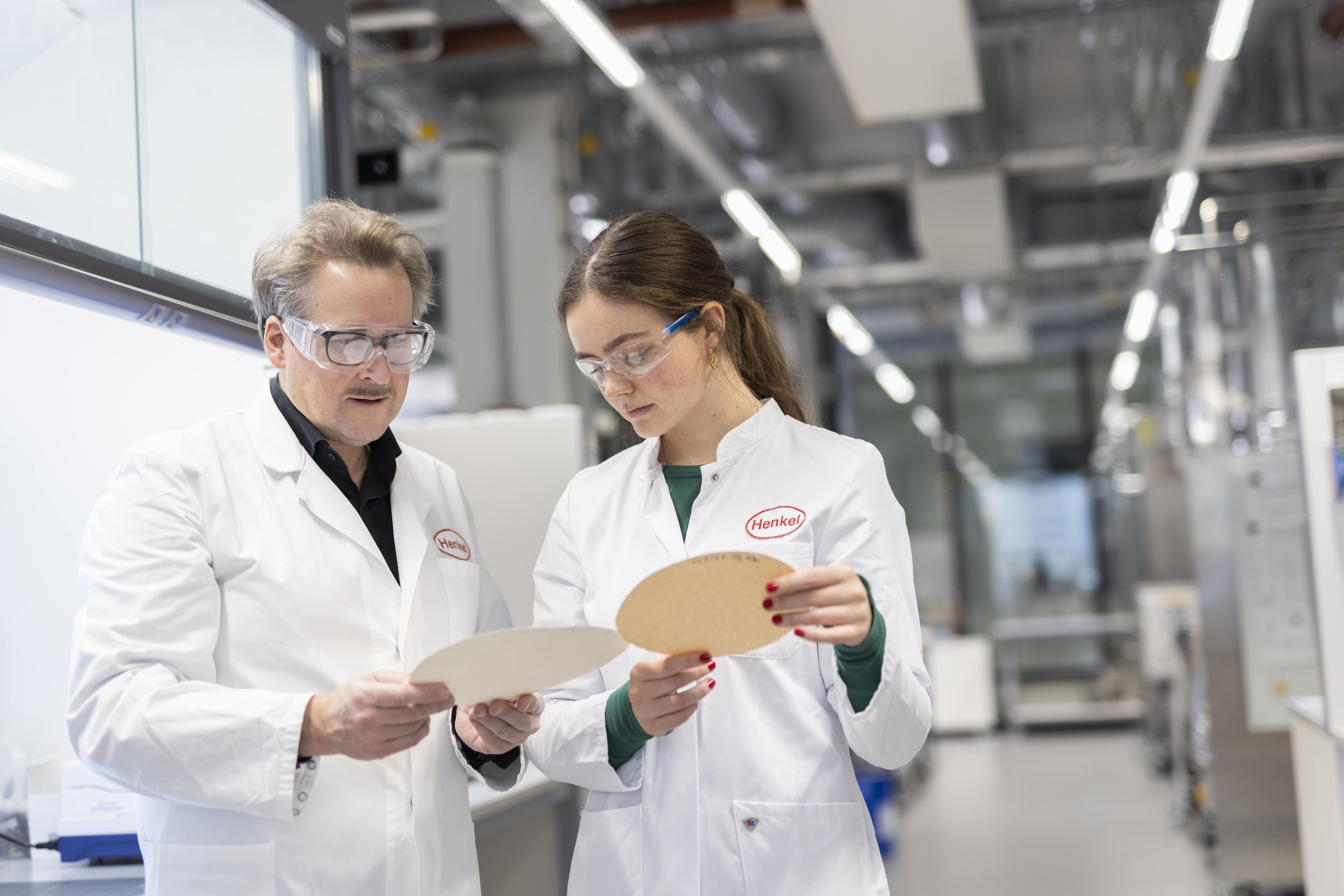 An image of a man and a women in Henkel uniform