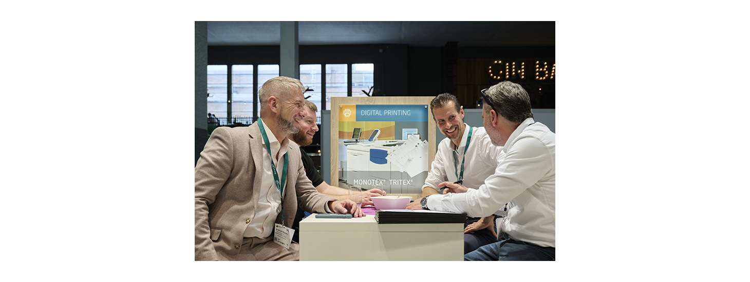 A group of peers interact at Labelexpo Europe 2023.